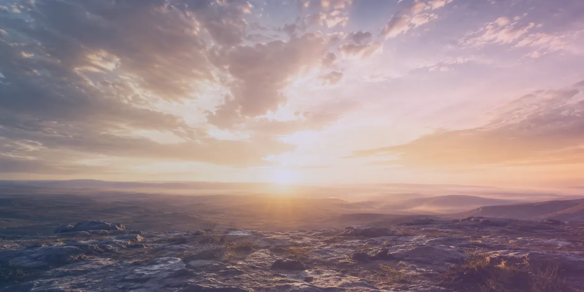 Sunset over rocky landscape with clouds